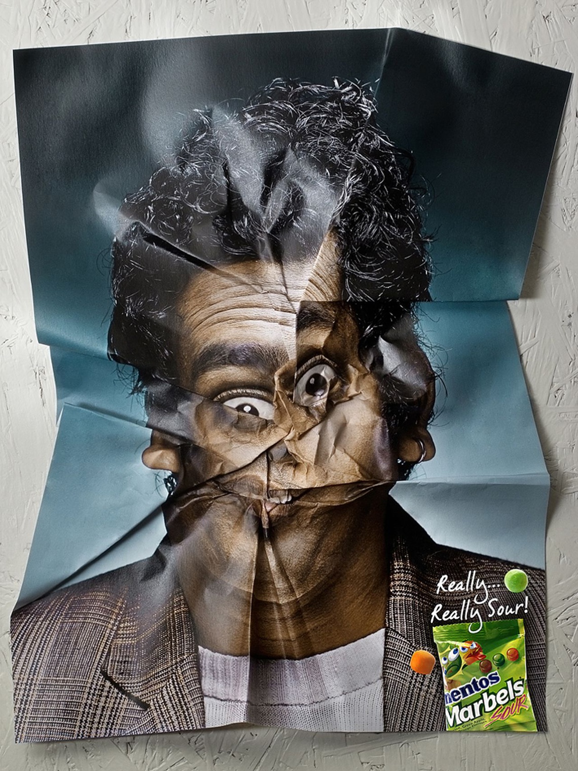 Ambient media campaign taking the form of crumpled posters.