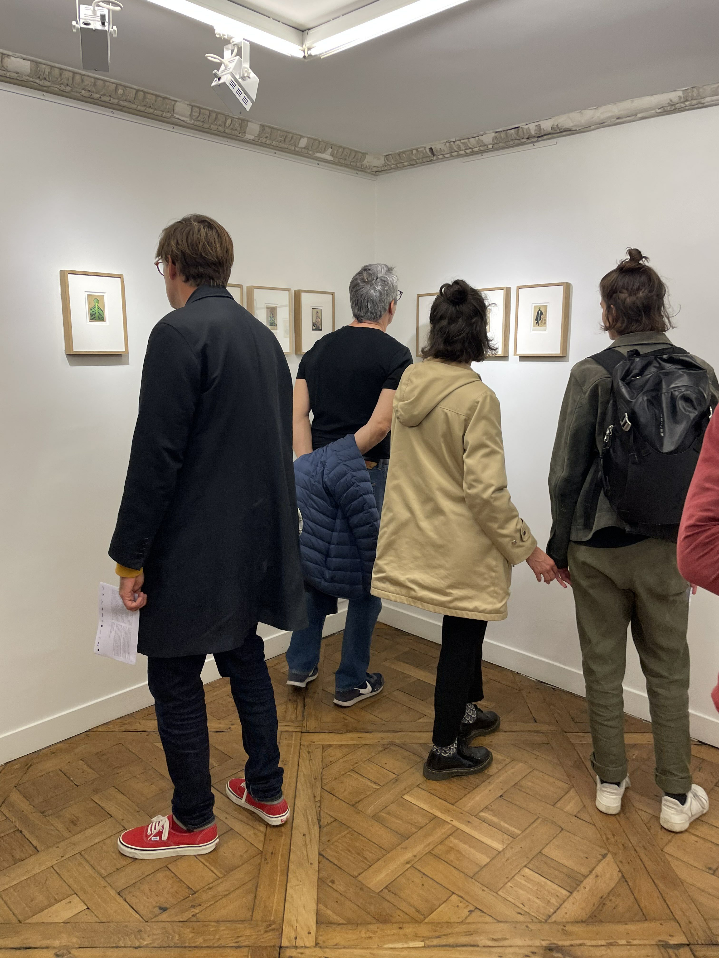 Not Paris Photo Fair: people looking at photography in a gallery