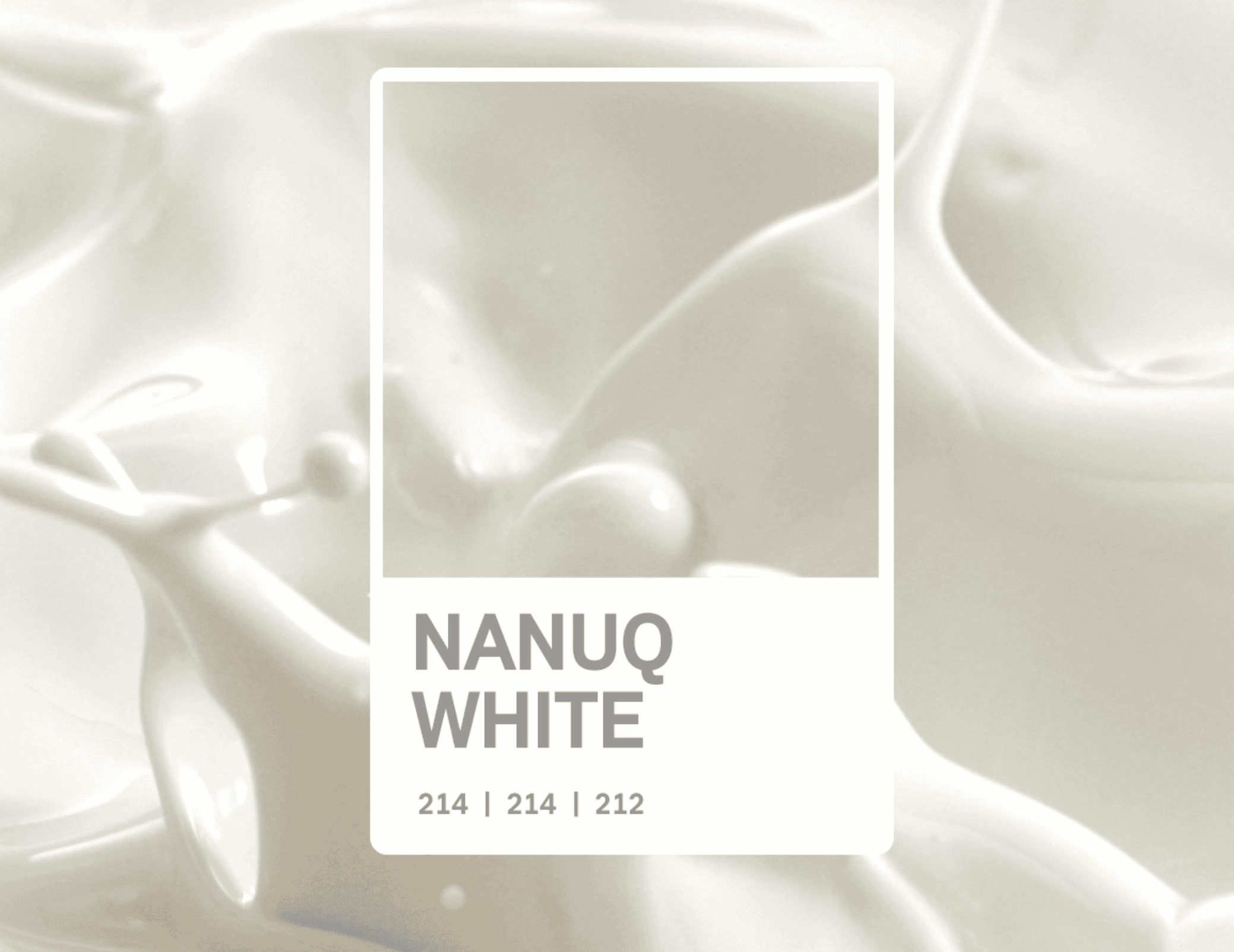 pantone graphic of 'nanuq white', a creamish-grayish white, represented by a photo of splashing milk.